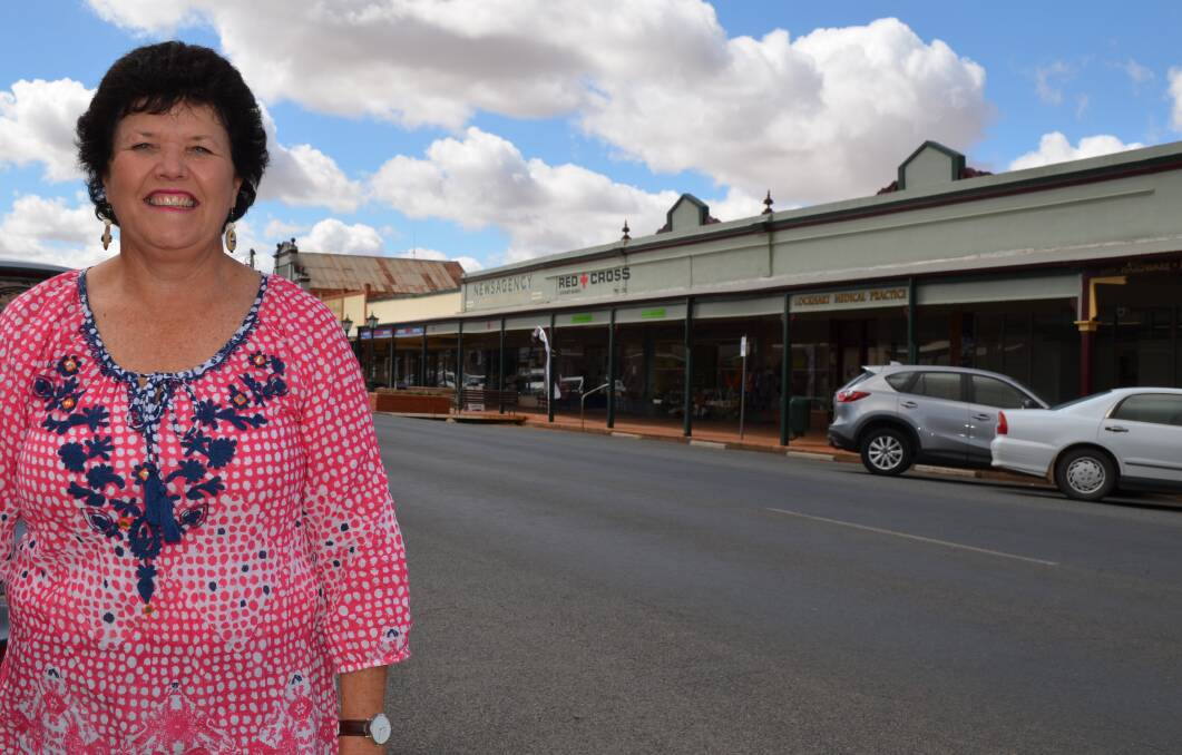 A TOWN KNOWN FOR VERANDAHS: Tana Webb of Lockhart is pictured in the main street where the shops are flanked by the characteristic verandahs. 