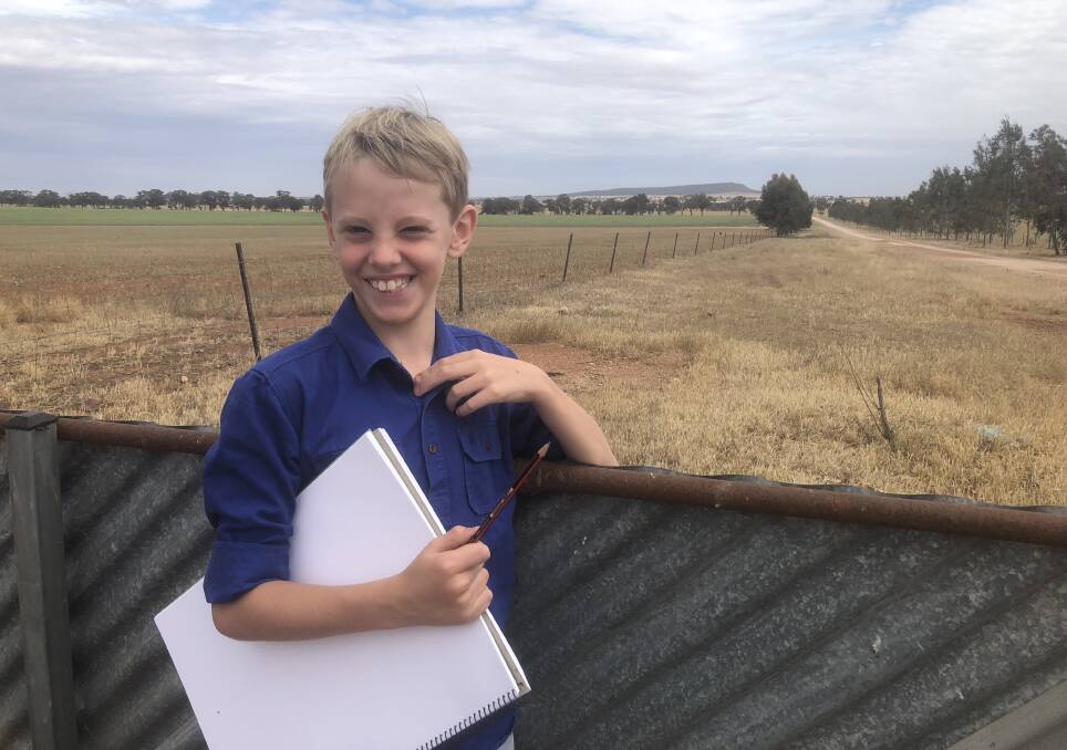 INSPIRING BACKDROP: Hudson Smith, 8, has plenty of inspiration when it comes to drawing rural images. 