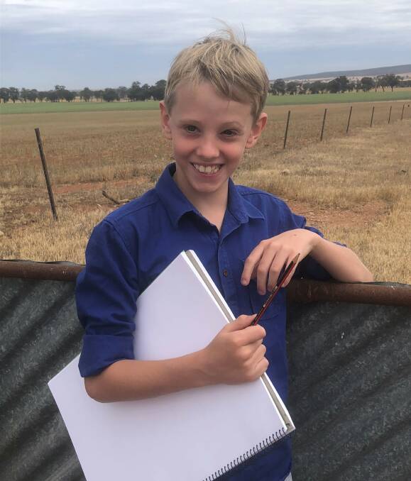 ON CANVAS: Lockhart boy Hudson Smith, 8 has won a national art prize depicting a drawing of grain harvest. 