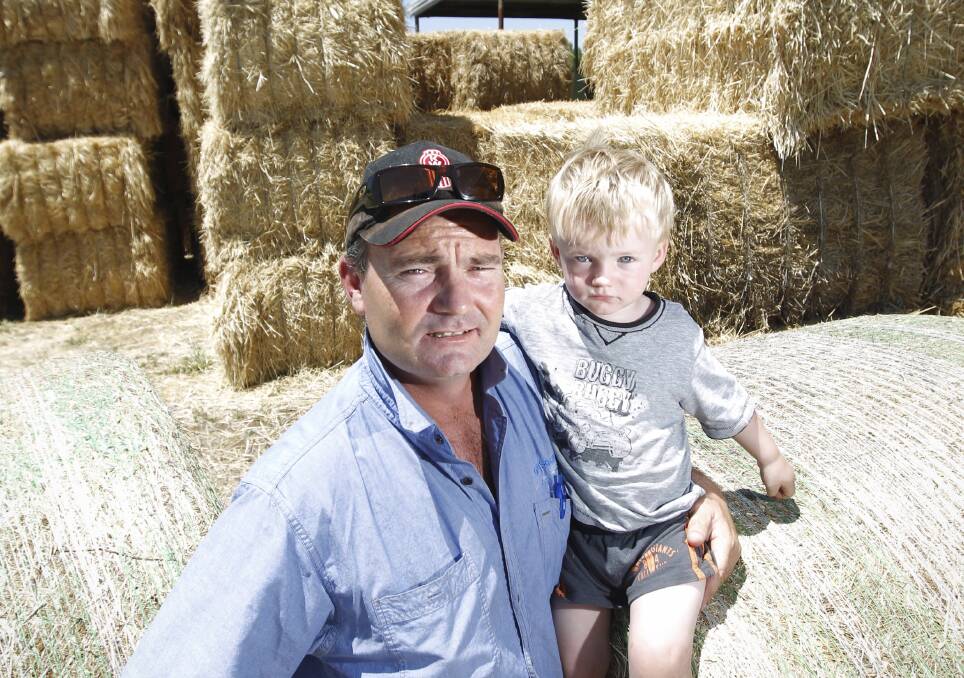 MATES HELPING MATES: Burrumbuttock Hay Runners organiser Brendan Farrell - pictured with his son - is making plans for the biggest and best run yet.
