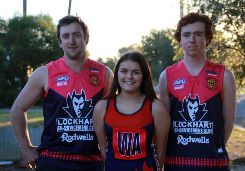 CHARITY DAY: Lockhart's Kyle Pertzel, Jayden Renner and Oscar Smyth show off the pink colours the club will wear on Saturday.
