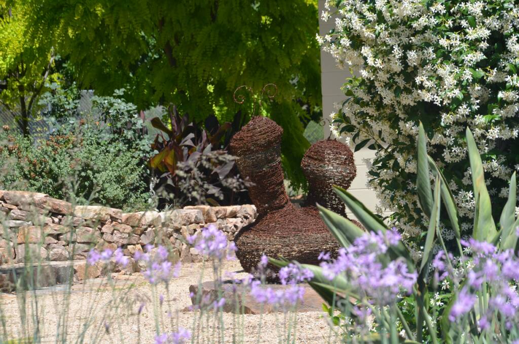 WALL-TO-WALL WONDERS: The garden at Coorong, Jindera features many dry stone walls and recycled artworks with an abundance of natives softened by old roses, salvias and other bedding varieties. 