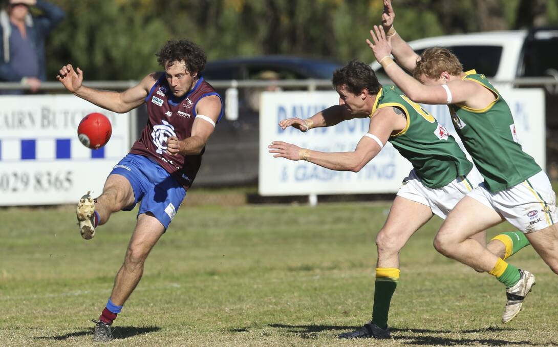 ON TOP: Dane Hallinan gets another kick away for Culcairn in their win over rivals Holbrook at Culcairn on Saturday. Picture: ELENOR TEDENBORG