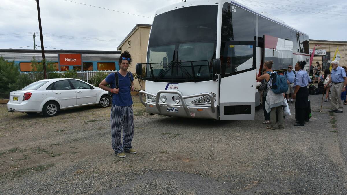 MOVING ON: Brunswick passenger Jordan Brown boards the bus at Henty after the XPT malfunctioned on Wednesday afternoon.