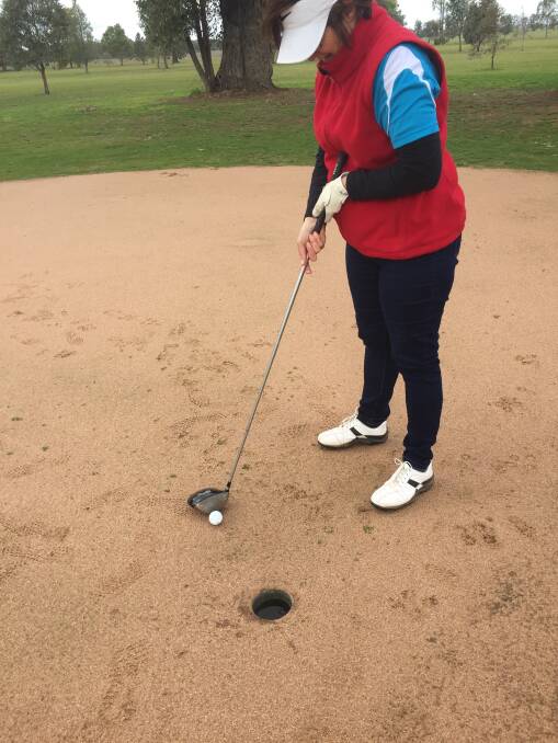 CHALLENGE: Glenys Yates putts with a driver at Henty. Picture: Contributed