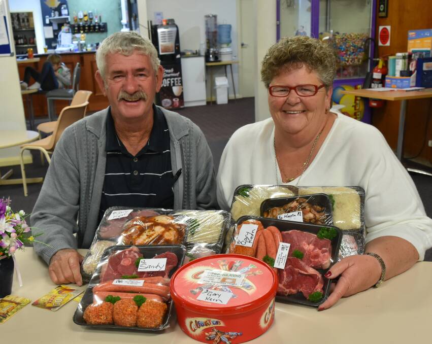 BIG WINS: Gary and Sandy were very pleased with their winnings at the Henty Club raffles held last Friday. Picture: Lorri Roden
