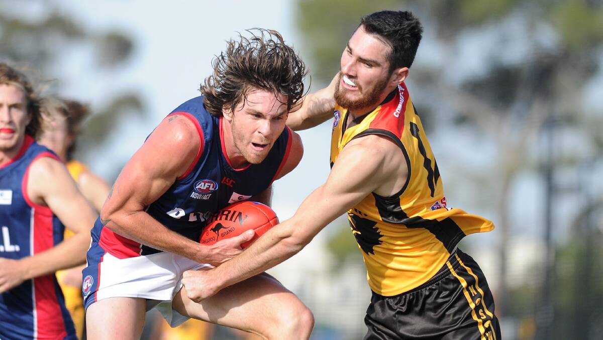 REPRESENT: Riverina Football League's Luke Sicker and Hume Football League's Jesse Margosis clash during the representative match at Robertson Oval at the weekend. Picture: Laura Hardwick