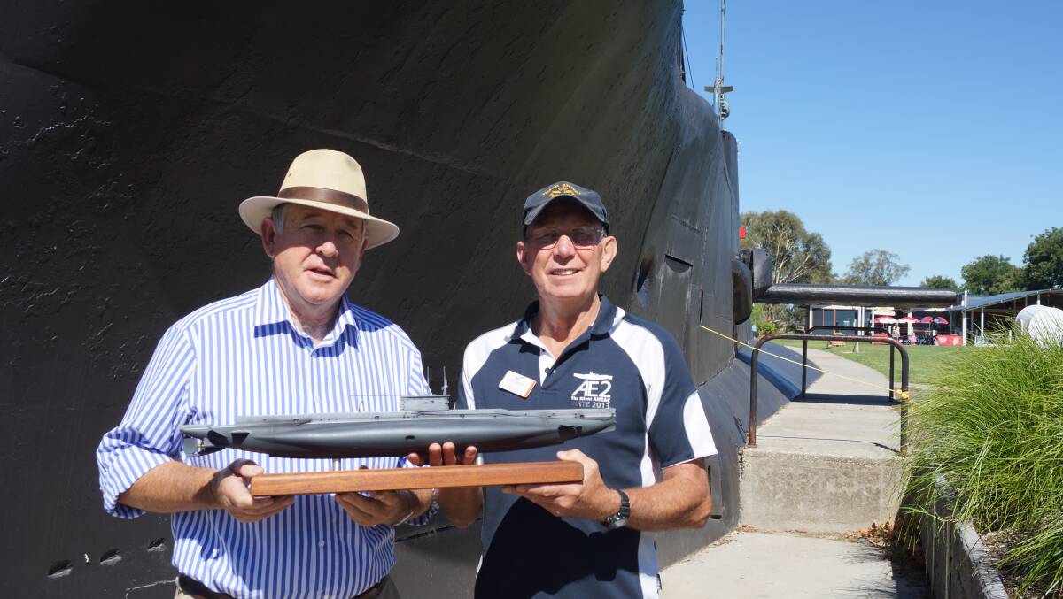 On hold:  Holbrook RSL sub-branch president, David Hocking and Holbrook Submarine Museum Curator, Roger Cooper with a model of the AE2 submarine which will be built in Submarine park. Work on the replica was due to start in Febuarary buy a stall in funding has delayed the start date.