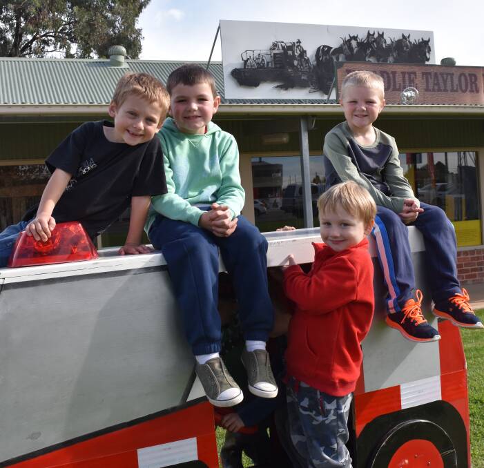 Fiery experience: Lachlan D'Amelio, Jett Weston, Alexander Berg and Ryder Montgomery at the Henty Fire Station open day. More photos on page five and online. Picture: Lorri Roden. 