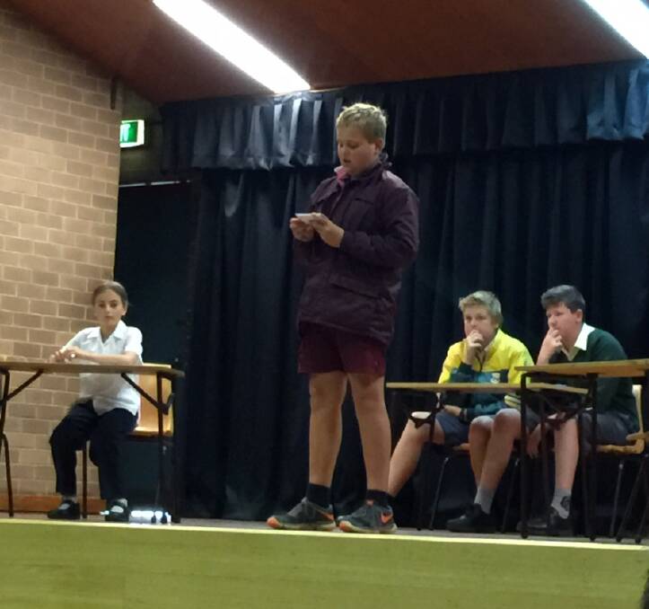 Debating: Lachlan Knobel took to the stage debating if homework should be banned at the Billabong High School on Friday May 20.