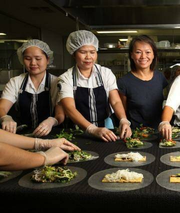 "I have lost my business. That's the biggest price to pay": Nahji Chu, owner and founder of MissChu, with some of her staff. Photo: Louise Kennerley