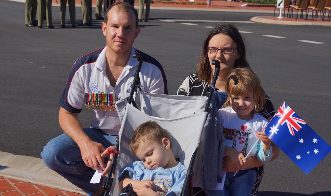 Jason and Rebecca with their children Savannah and Leland. Jason is wearing his grandfathers medals