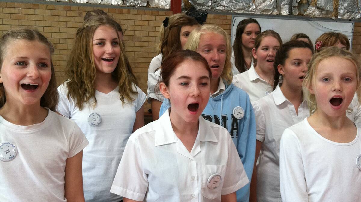 Faith Pyers (second row second from left) from Billabong High School and Ruby Bouffler (front row far right) from Lockhart Central School at the recent choral camp in Wagga. 