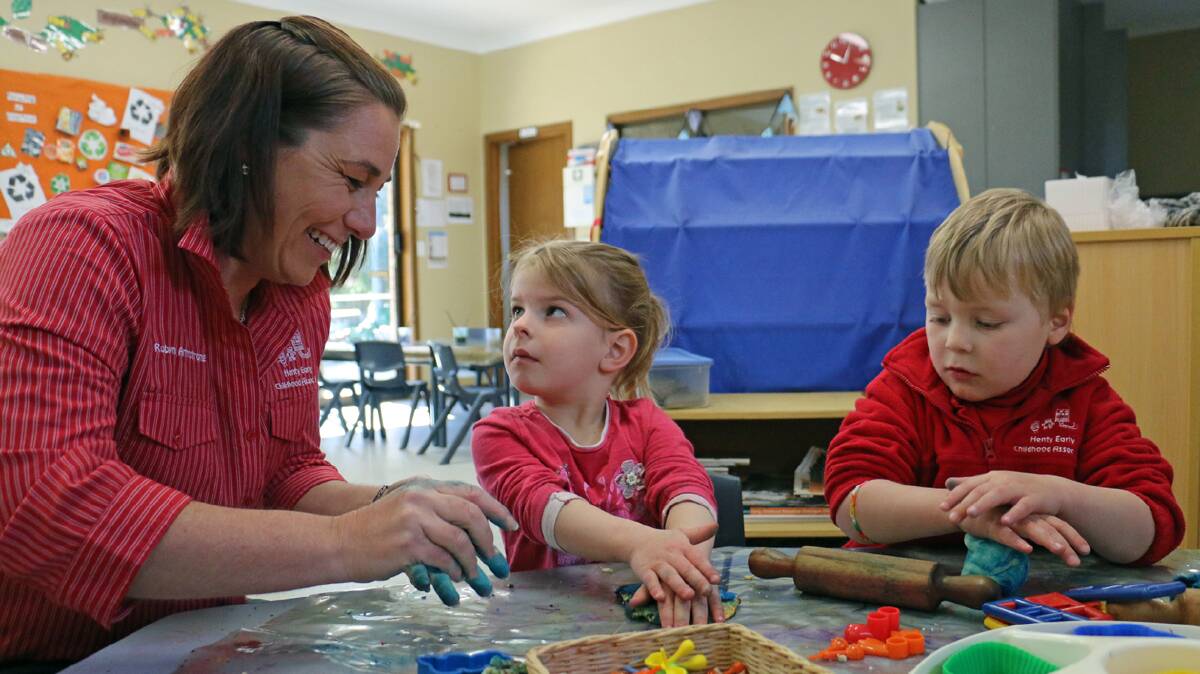  Henty Early Childhood Association co-ordinator Robyn Armstrong with Allira Thompson, 3, and Fergus Meyer, 4.