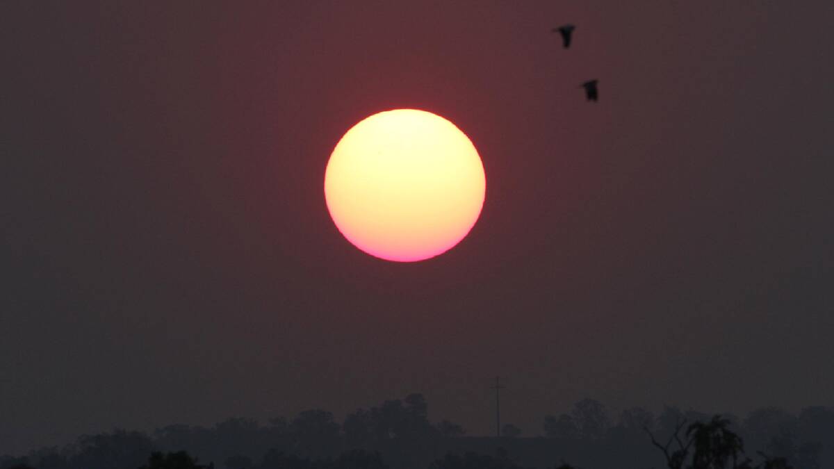The haze from bush fires that ravaged NSW settled over Waggaa, making for a rather spectacular sun set. Picture: The Daily Advertiser