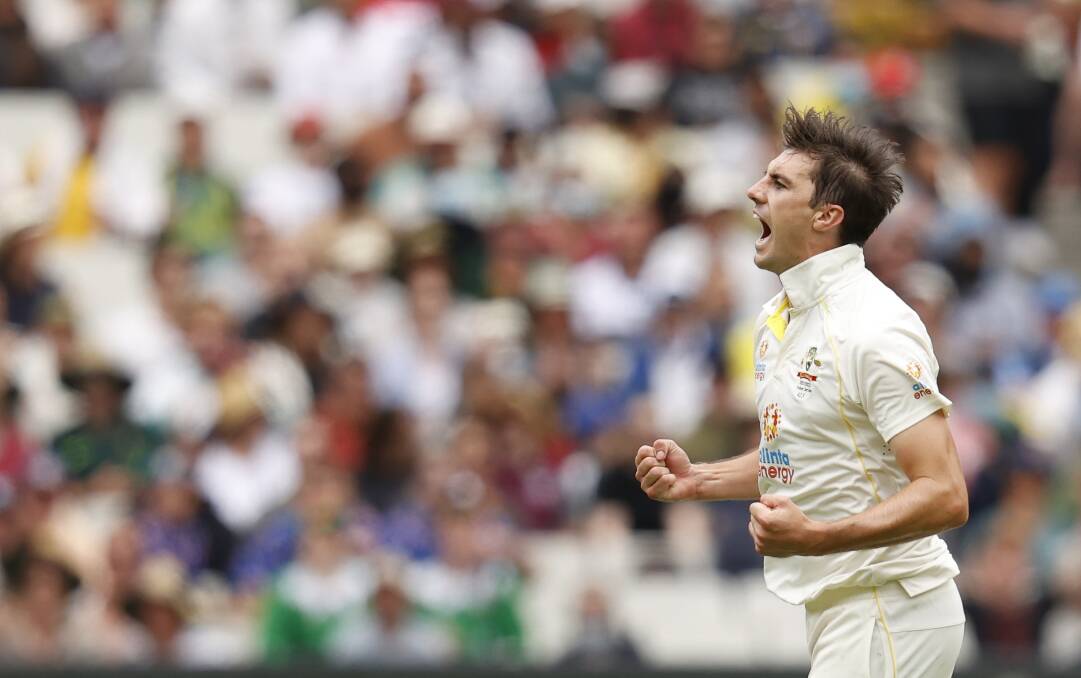 DOMINATE: Pat Cummins celebrates the wicket of Dawid Malan during day one of the third Test match on Boxing Day. Picture: Getty