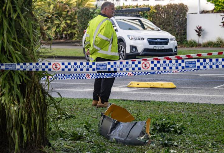 Debris from a helicopter is seen after it crashed into the roof of the DoubleTree by Hilton Hotel, in Cairns on August 12, 2024. Picture AAP Image/Brian Cassey
