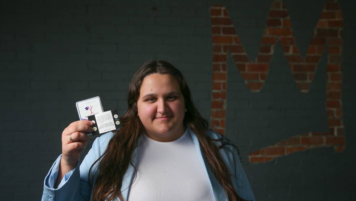 Sarah Williams, founder of What Were You Wearing, holds drink spiking kits. She hosted a Halloween party in Newcastle in 2022 and gave out free drink spiking kits. Picture by Marina Neil