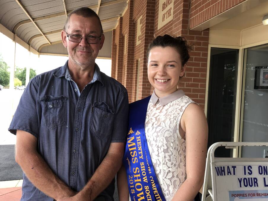 COMMUNITY CONNECTION: Henty Show Society president Warren Dale is pictured with Henty Showgirl Emily Jones. Picture: Nikki Reynolds