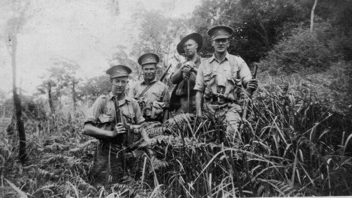VALUABLE CONTRIBUTION: Private Ronald (Bill) McPhee, with a a group of of 'spotters' in New Guinea WWII. 