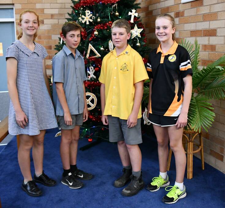 CAPTAINS: School captains from Henty Public School and St Paul's Lutheran School Helena Brown, 12, Johnathan Coe, 12, Micah Lieschke and Susie Male, 12, at the combined schools Christmas service. 