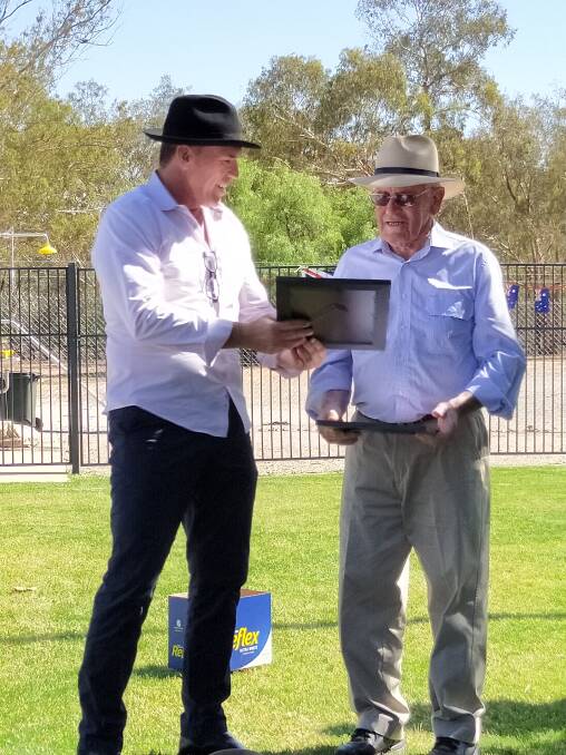 AT THE ROCK: Lockhart Shire Australia Day Ambassador, Mark Warren presents Ian Weily with the citizen of the year award. Picture: Supplied