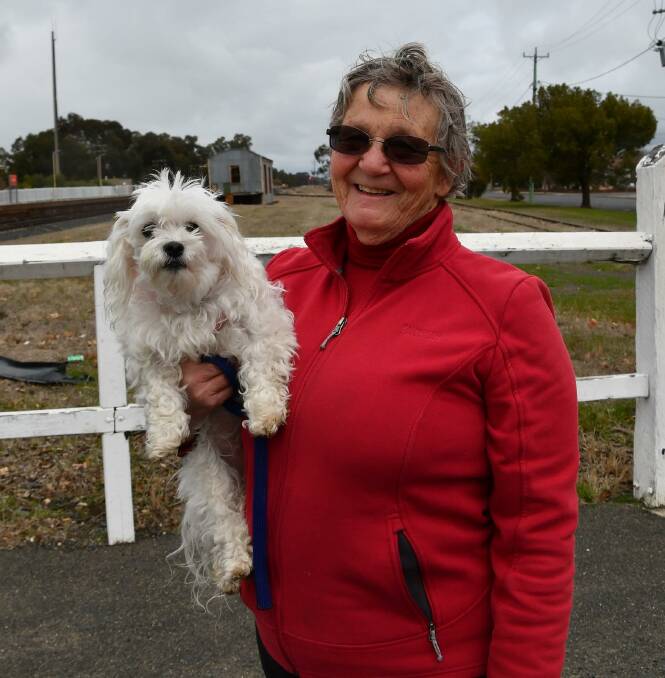 GRATEFUL FOR RAIN: Wet weather doesn't stop Sally Stevens from taking Jessie out for a walk at Henty. Picture: Lorri Roden