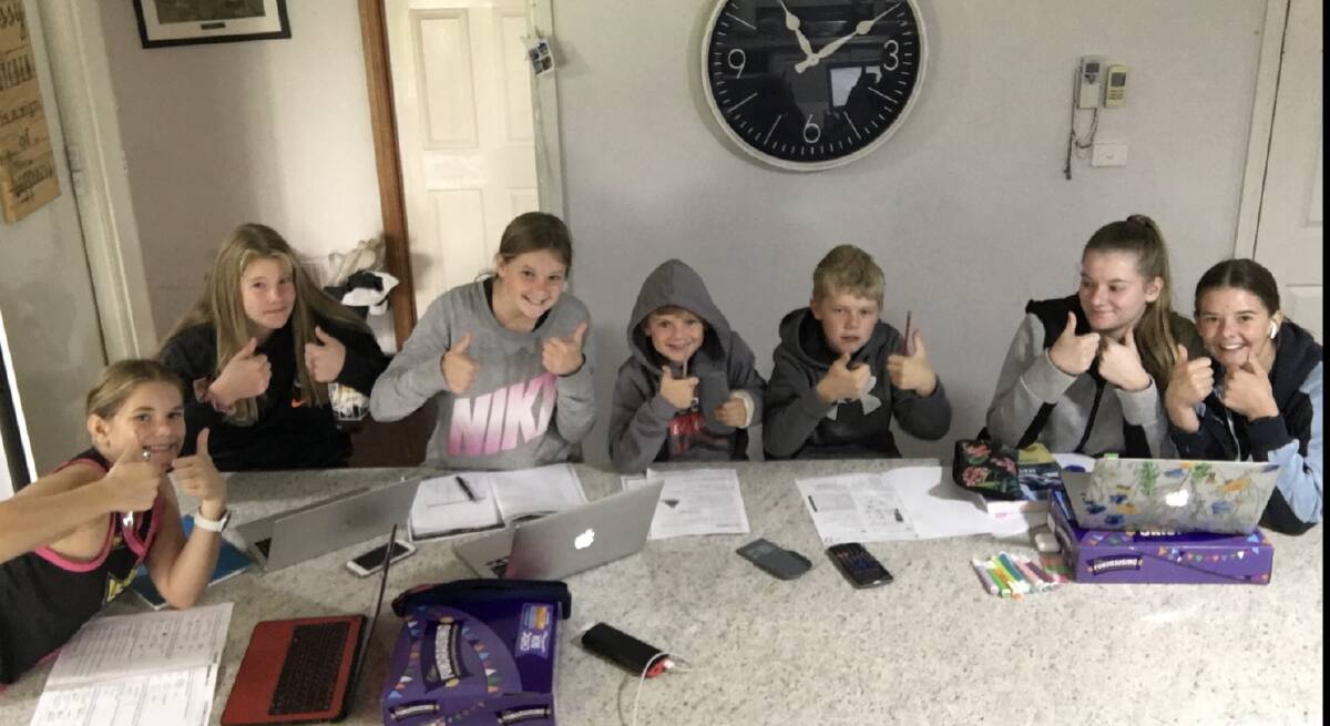 A CLASS OF THEIR OWN: Members of the Kennedy family, Molly, 15, Grace, 16, Annie, 13, Patrick, 8, Thomas, 11, April, 18, and Rose, 17 embrace home learning. Picture: Supplied