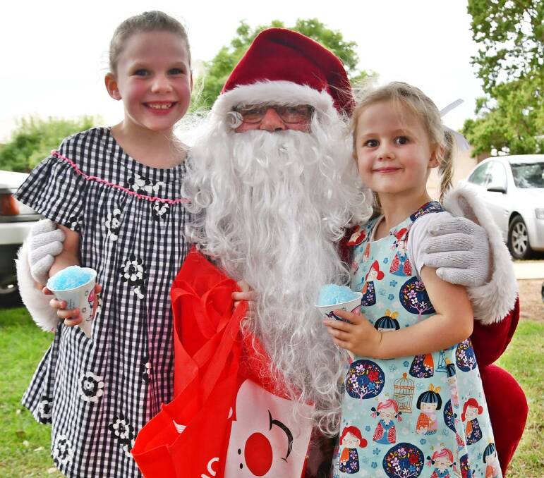 SANTA PHOTO: Sisters Ava, 6, and Ivy, 4, Brown were excited to see Santa. 