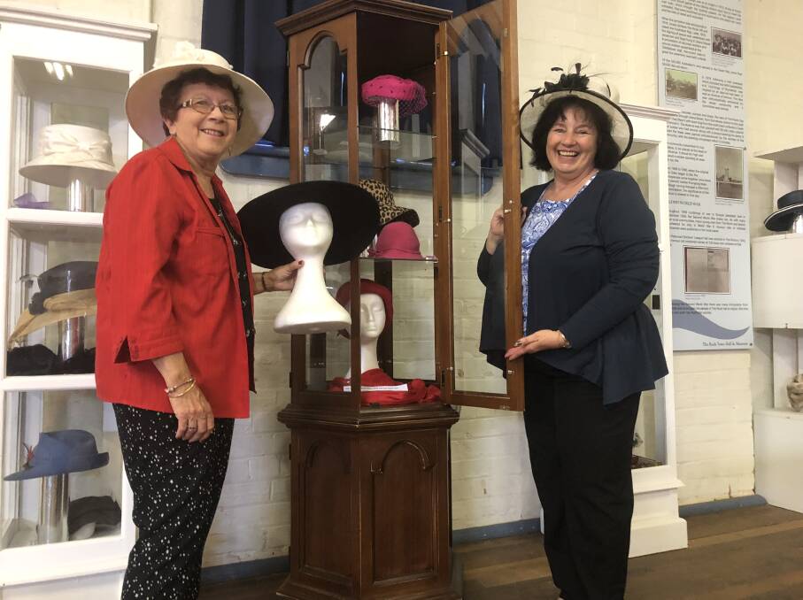 HATS OFF: Nancy Smith and Louise Scott of The Rock prepare for an upcoming event which will showcase a diverse array of hats and facinators. Picture Nikki Reynolds