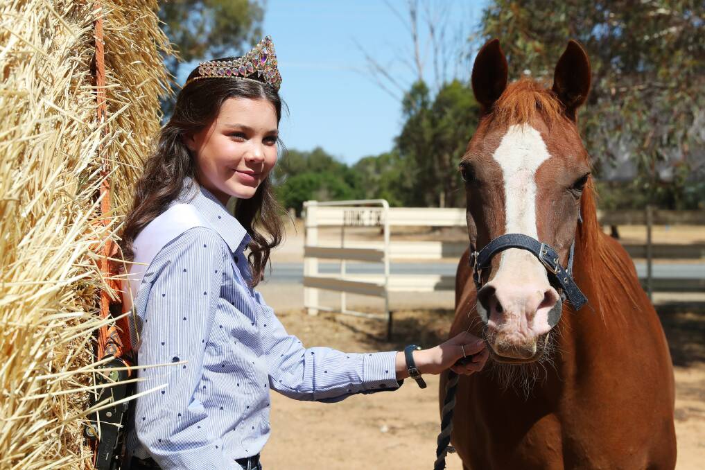 GIFT OF GIVING: Sara Stevenson, 14, of Lockhart is pictured with Wagga RDA horse Dreamy during a donation of fodder. Pictures: Emma Hillier