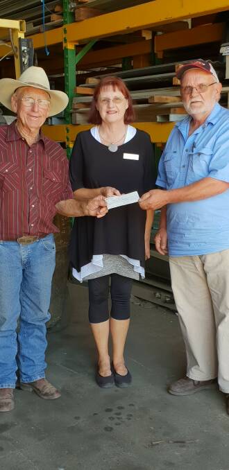 SUPPORT: John 'Happy' Gill of The Rock and Gil Mathew are pictured with Jane Pottie, a representative of Kurrajong Waratah, as they present a cheque worth $3145, which was raised from Gil Mathew Wagga Pro Rodeo. 