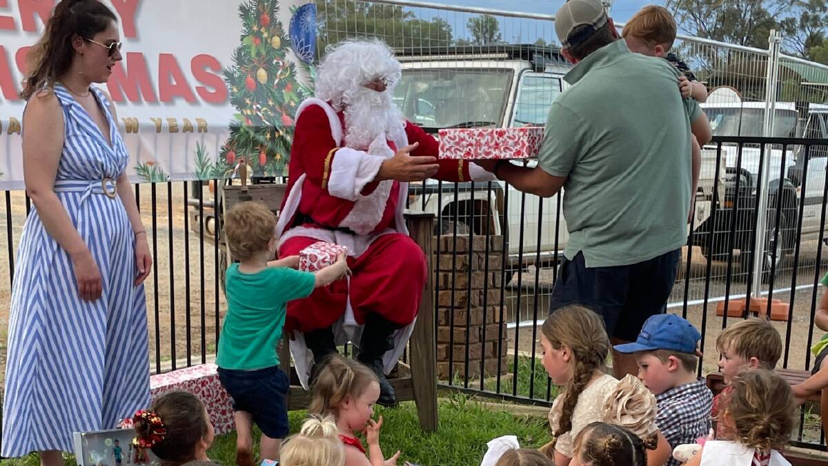 Santa working hard at the Hermidale Christmas Tree lighting. Picture by Grace Ryan Santa working hard at the Hermidale Christmas Tree lighting. Picture by Grace Ryan