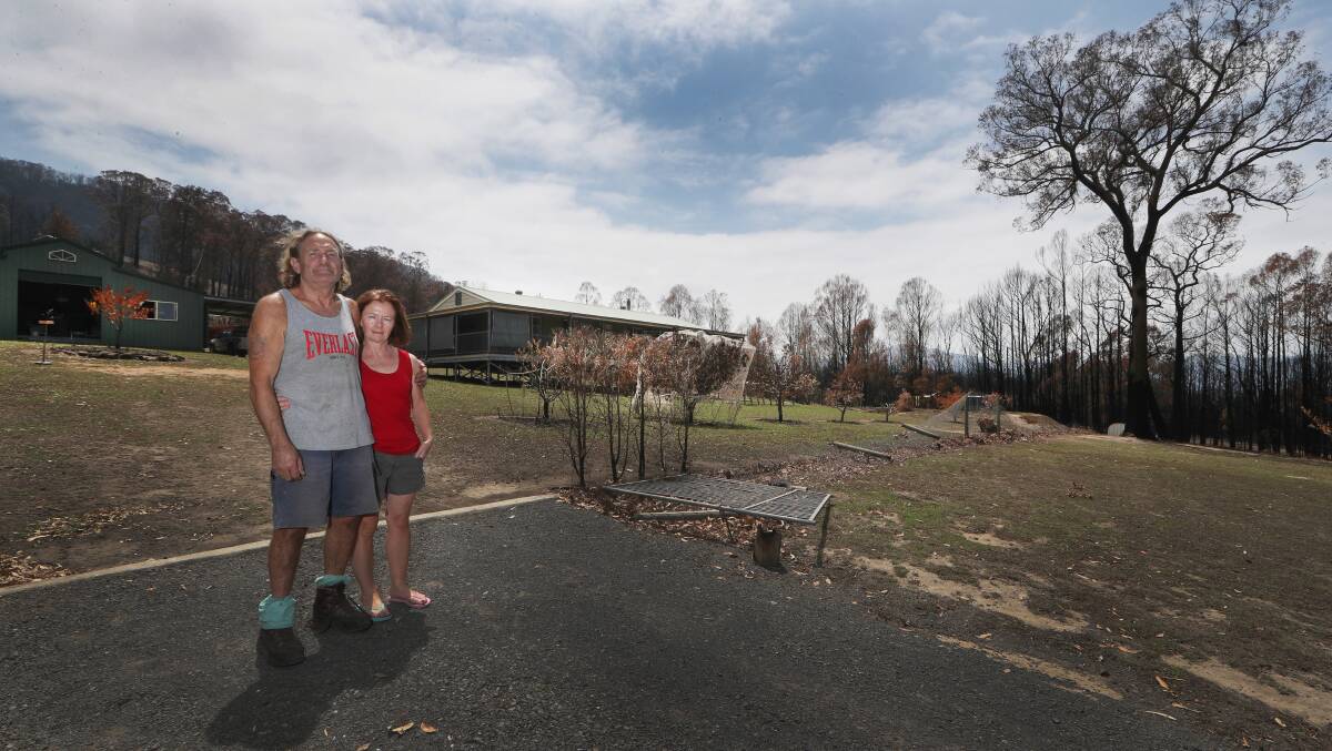 SAVED: Andy and Brigid Jordan in front of the home they defended on January 4. Photo: Robert Peet