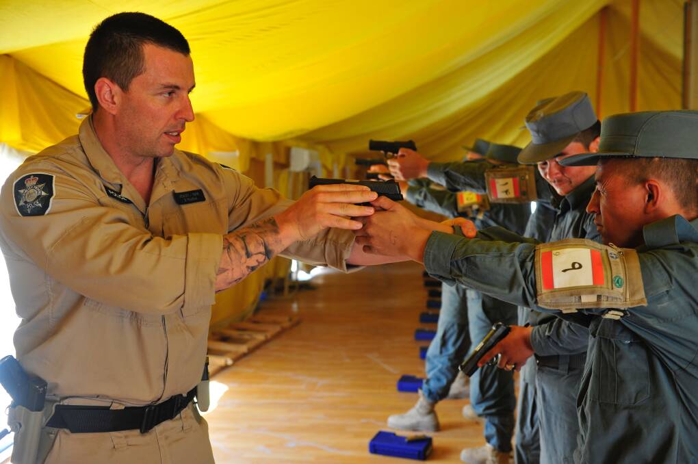 David Healey training Afghan National Police officers in 2010. Picture: Supplied