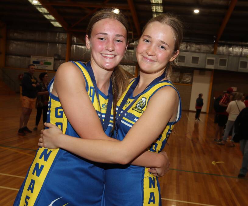 SISTER ACT: Phoebe and Claire Wallace after helping Mangoplah-Cookardinia United-Eastlakes to grand final victory over Collingullie-Glenfield Park on Saturday. Picture: Les Smith