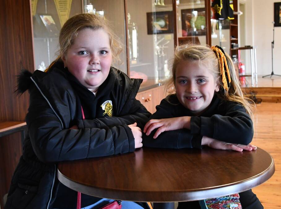 Millicent Bahr, 9, and Matilda Gleeson, 7, love playing netball with the Osborne team.