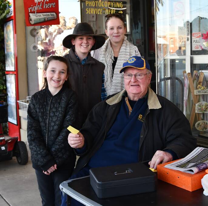 Grahame McMullen welcomed newcomers to Culcairn,  Nicole, Alex, 11, and Piper, 8, Pope, who supported a wood raffle run by the Culcairn Lion's Club.