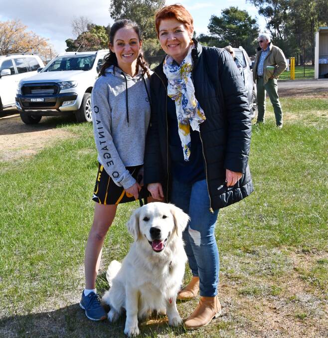 Tess and Jan Lyons with Archie, who was desperate to play netball with the team.