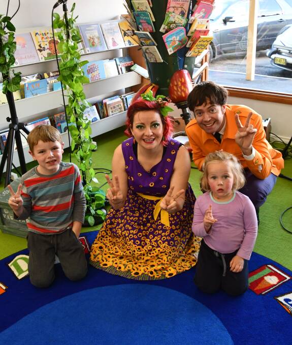 Kai Weston, 6, and Harriett Schuller, 3, had fun singing and dancing with Sir Paul McCarrot and Rue Barb at the Henty Library.
