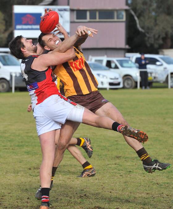 Tim Smith battles it out with North Wagga's Daniel Jordan during a Farrer League game at Gumly Oval in 2016. 