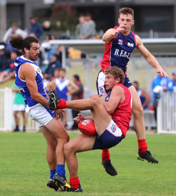 Riverina's Jayden Klemke marks on Satuday as Brocke Argus and Tom Keogh watch on at Robertson Oval. Picture: Les Smith