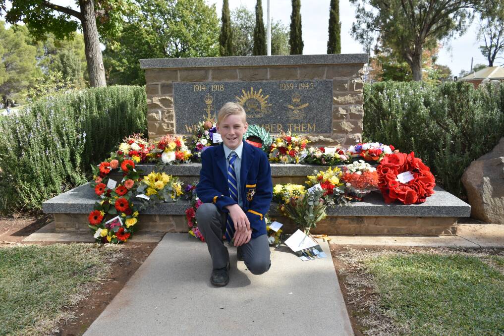 FOR THE DIGGERS: Bailey Armstrong pays his respect to the fallen heroes of World War I, at last year's morning service on Anzac Day in Henty. 