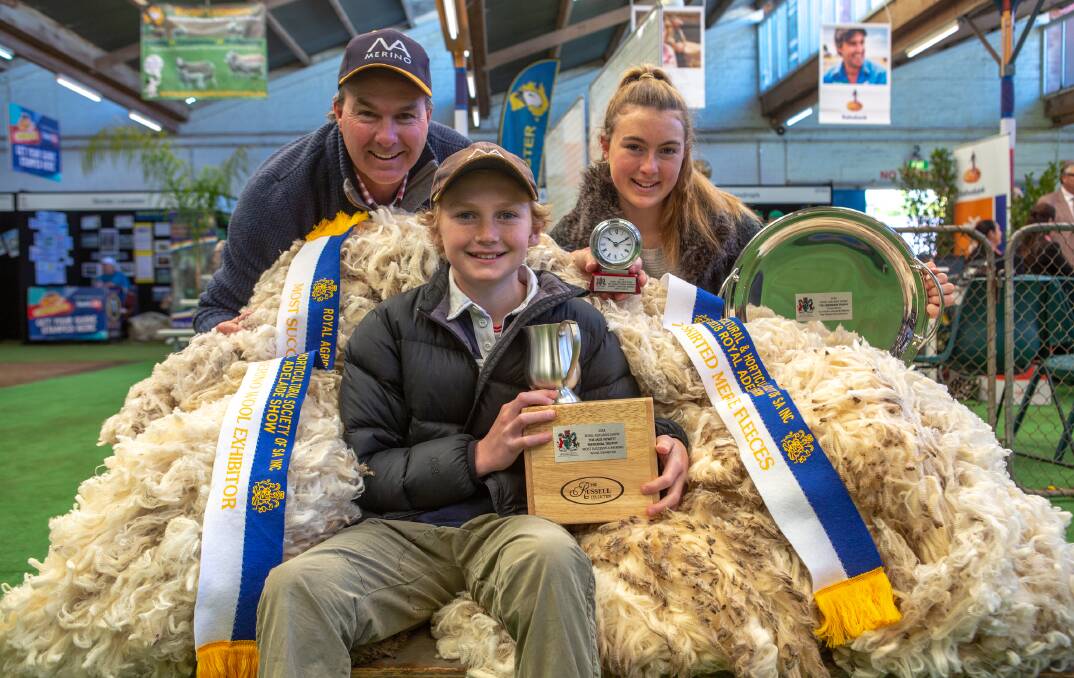 Matt, Dougal and Emily Ashby, North Ashrose, Gulnare, SA, celebrate their sheep stud's wool winning at the 2018 RAS. 