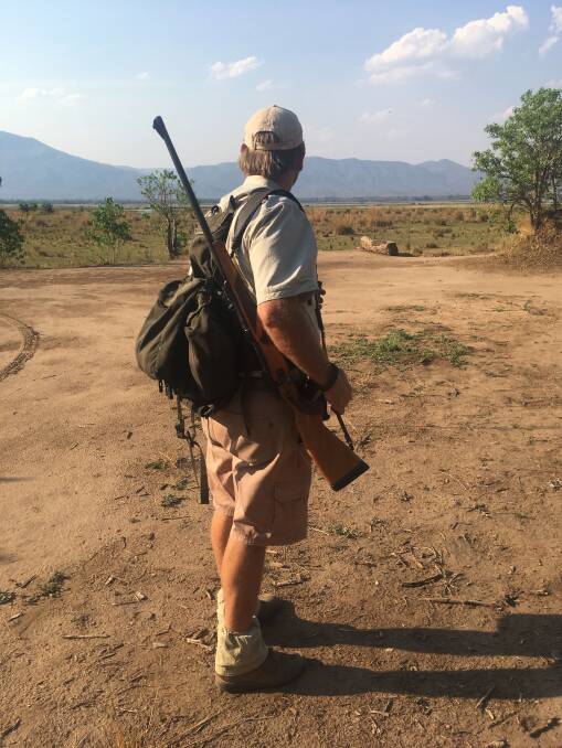 Guides have your back on a walking safari past lions and elephants. Picture: Craig Tansley