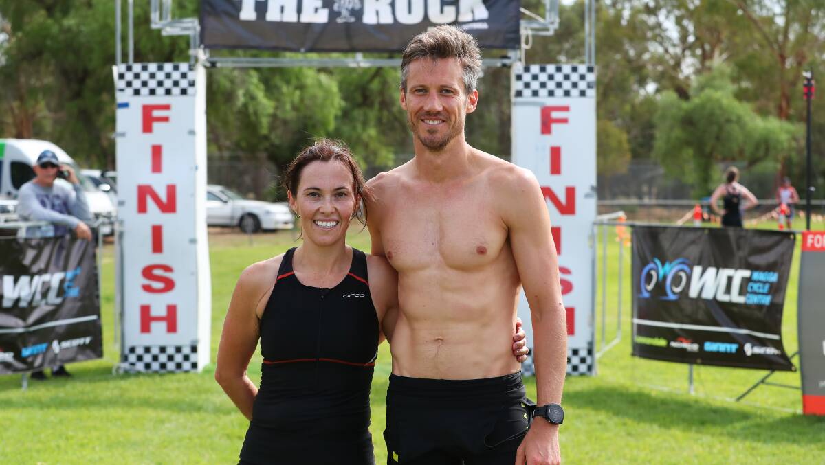 WINNERS ARE GRINNERS: Claudia Taylor and Scott Donaldson celebrate their success at The Rock Triathlon on Sunday. Picture: Emma Hillier