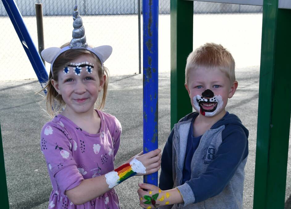 FEAST OF FUN: Eleanor Sanderson, 7, and Simeon Lubke, 5, enjoy the fun and food at St. Paul's Feast Day.