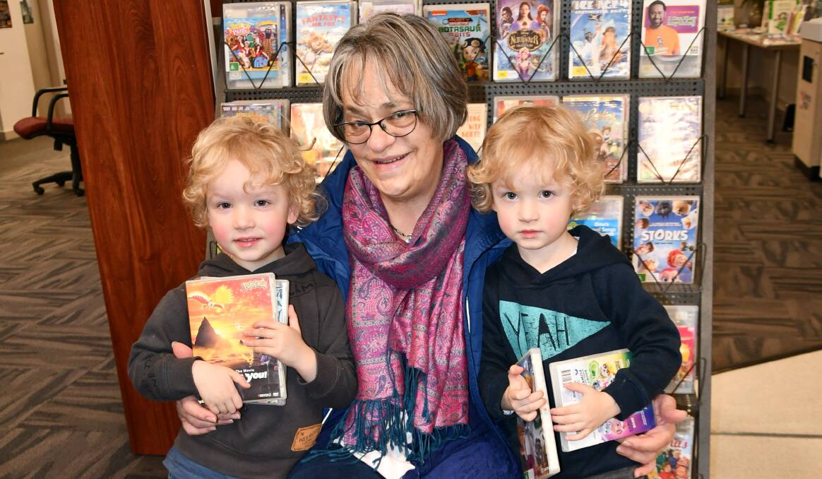 MOVIE BUFFS: Four-year-old twins Judah and Teddy Wilksch took their grandmother Dale Vaughan, of Mildura, to the Culcairn Library to choose some DVDs.