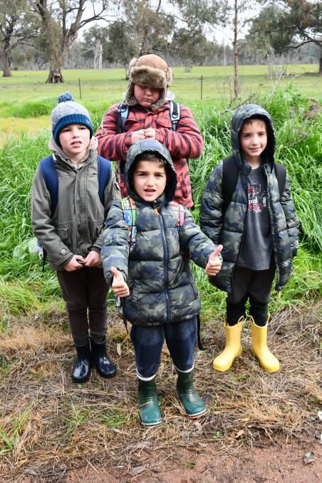 RUGGED UP: Harlan Candy, 11, Kai Weston, 8, Alexander Sturm, 9, and Eli Sturm, 9, enjoy the Beanies and Boots day.