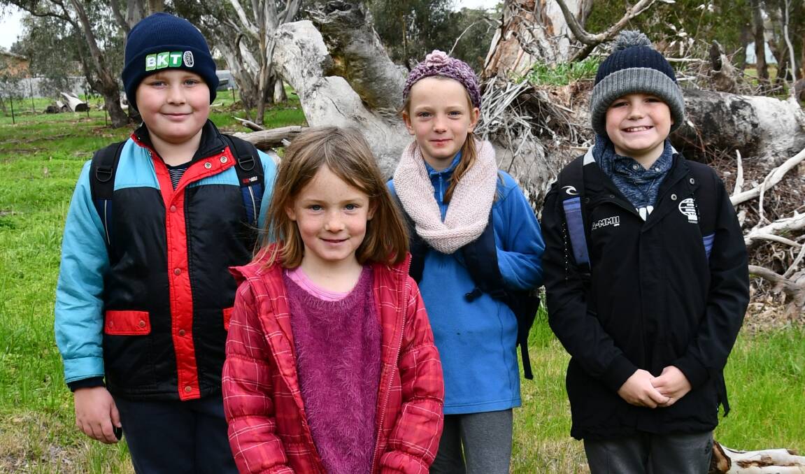 WALK IN THE PARK: Fergus Meyer, 9, Milly Forrest, 8, Nina Forrest, 10, and Jett Weston, 11, took part in the Beanies and Boots day organised by Henty Preschool.